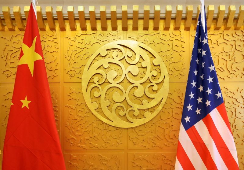 FILE PHOTO: Chinese and U.S. flags are set up for