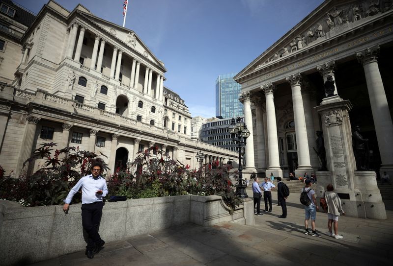A person stands outside the Bank of England in London