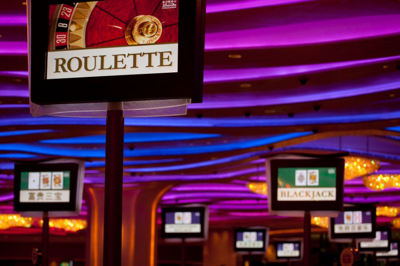 Electronic monitors are seen inside a casino on the opening