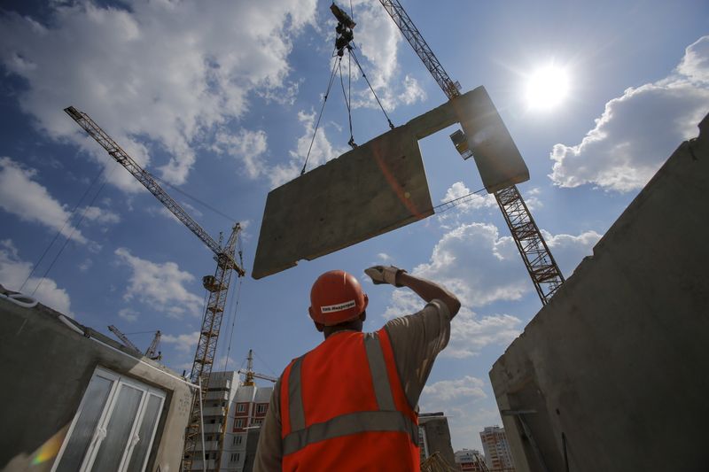 Construction worker operates at Russian real estate developer PIK Group’s