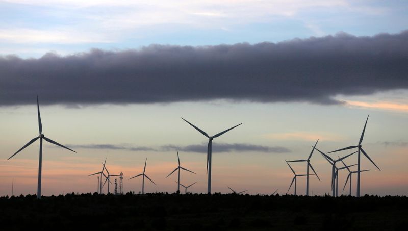FILE PHOTO: Iberdrola’s wind turbines at dusk in Moranchon, Spain