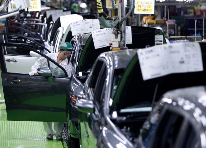 Worker assemble cars at Honda Motor’s Saitama factory in Sayama