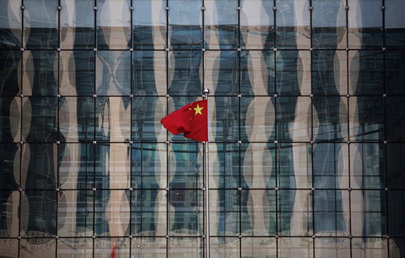 FILE PHOTO: Chinese national flag flutters at the headquarters of