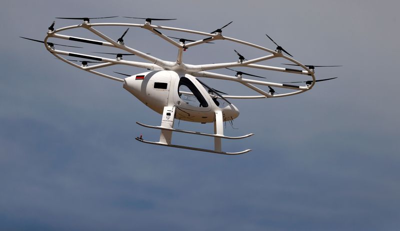 FILE PHOTO: A Volocopter air-taxi performs a flight over Le