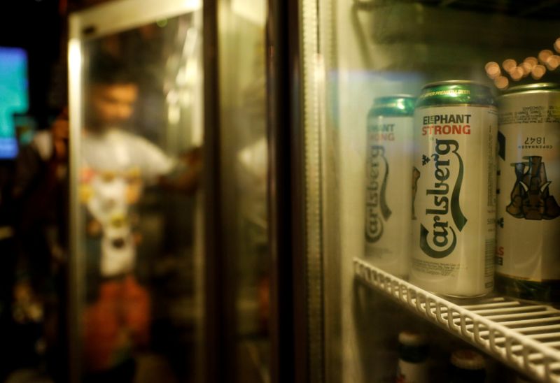 FILE PHOTO: Carlsberg beer cans are seen at a pub