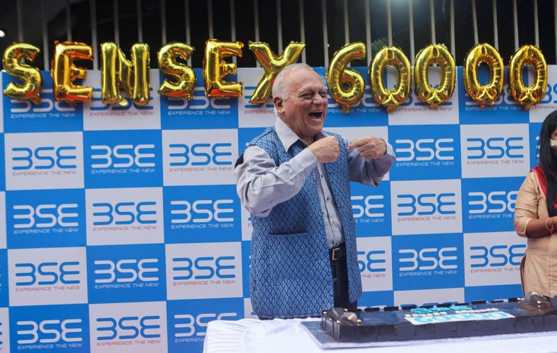 A man celebrates outside the the Bombay Stock Exchange (BSE),