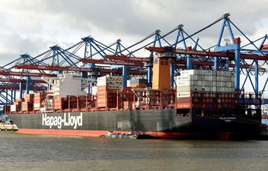 FILE PHOTO: A Hapag Lloyd container ship is loaded at