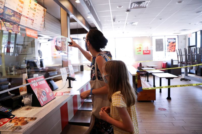 FILE PHOTO: Naomi and Lydia Hassebroek order treats from Taco