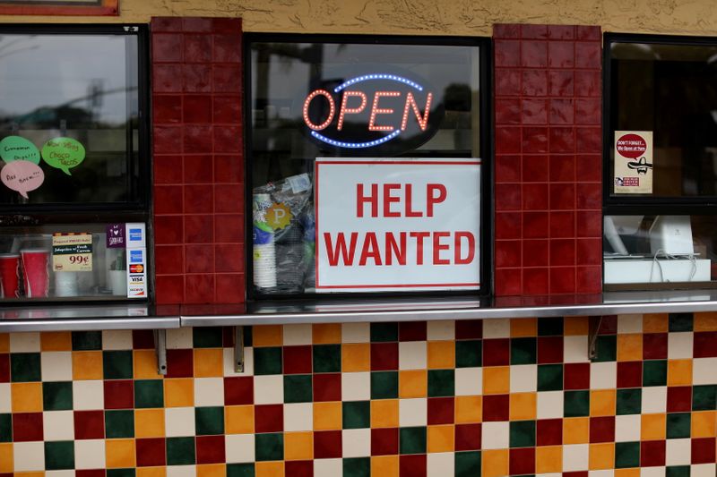 FILE PHOTO: A help wanted sign is posted at a