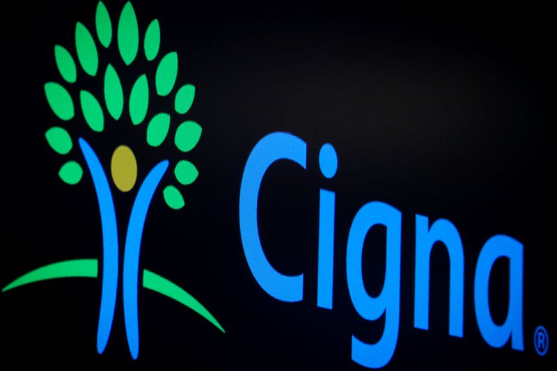 A screen displays the logo fro Cigna Corp. on the