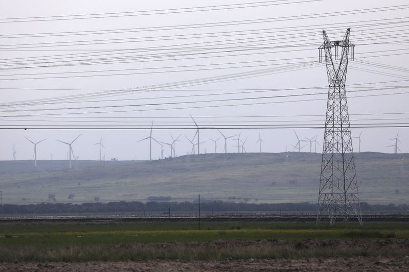 Electricity pylon and powers lines are seen in Zhangjiakou, Hebei