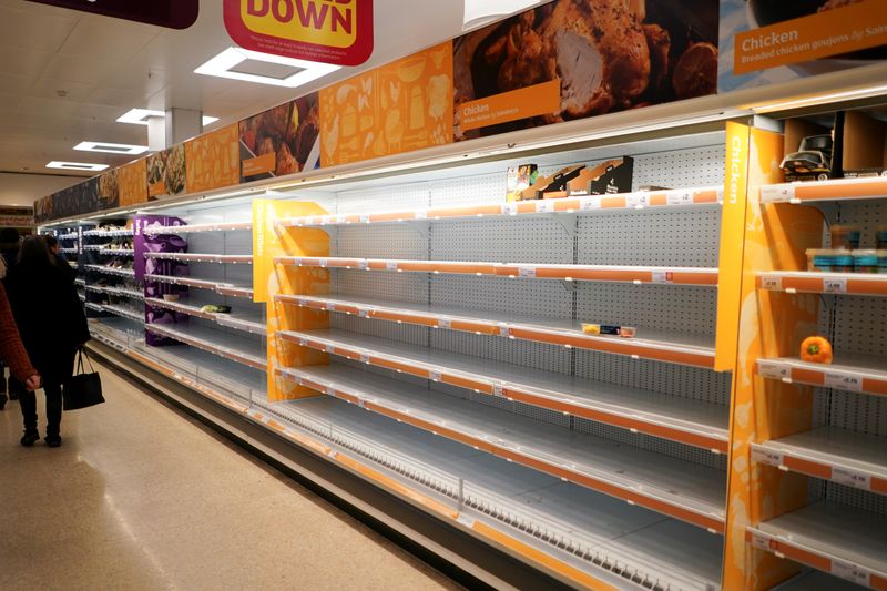 FILE PHOTO: Shelves empty of fresh chicken in a supermarket,