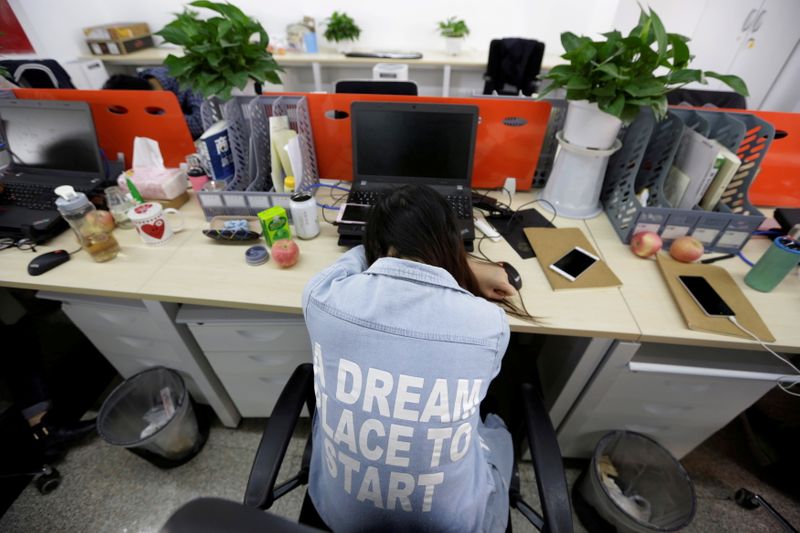 FILE PHOTO: Chinese tech workers disclose working hours in latest