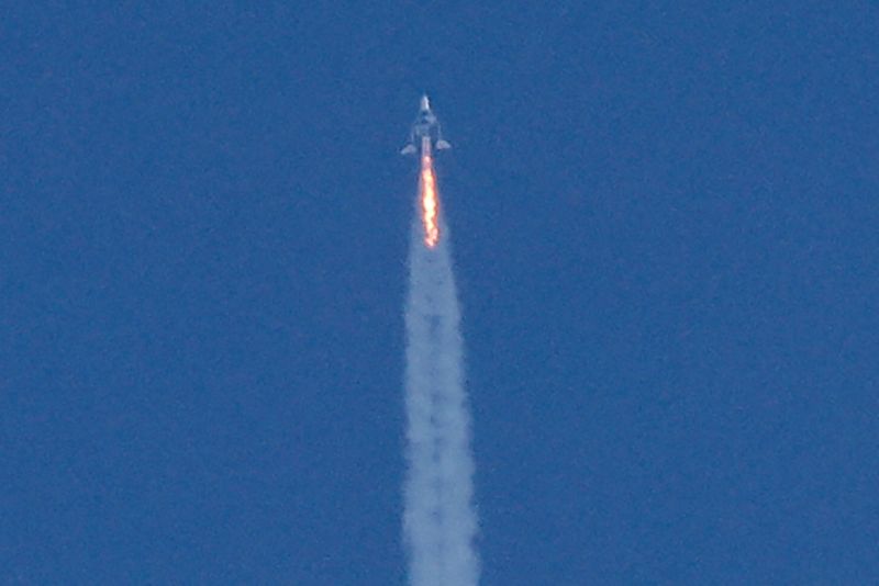 FILE PHOTO: Virgin Galactic’s passenger rocket plane VSS Unity begins