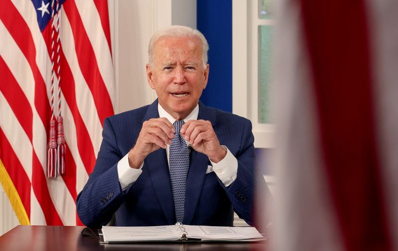 FILE PHOTO: U.S. President Joe Biden hosts a virtual coronavirus