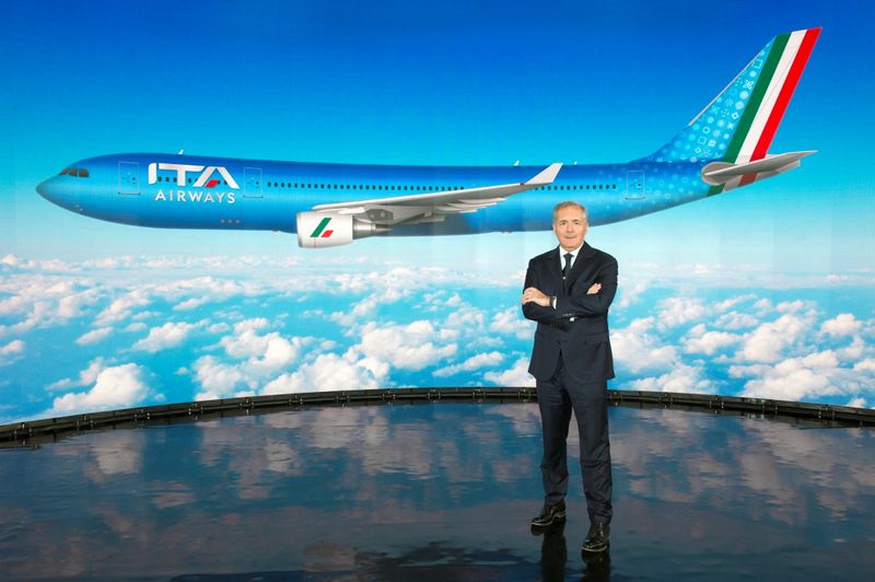 ITA Airways Chairman Alfredo Altavilla poses with the image of
