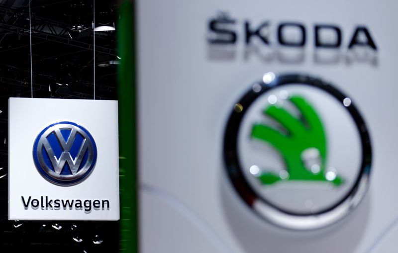 A Volkswagen (VW) logo is pictured next to a logo