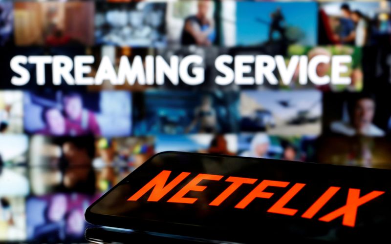 FILE PHOTO: A smartphone with the Netflix logo lies in