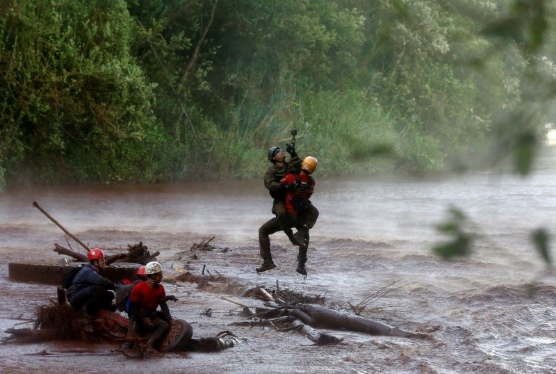 FILE PHOTO: Soldier helps a member of a rescue team