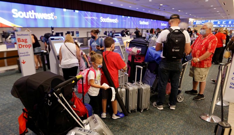 FILE PHOTO: Passengers check in for a Southwest Airlines flight