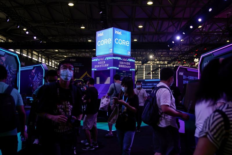 Visitors are seen at the Intel booth during the China
