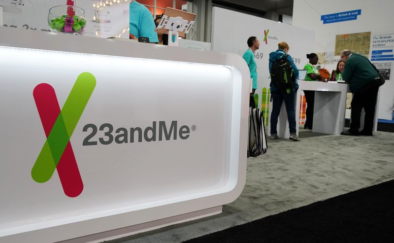 Attendees visit the 23andMe booth at the RootsTech annual genealogical