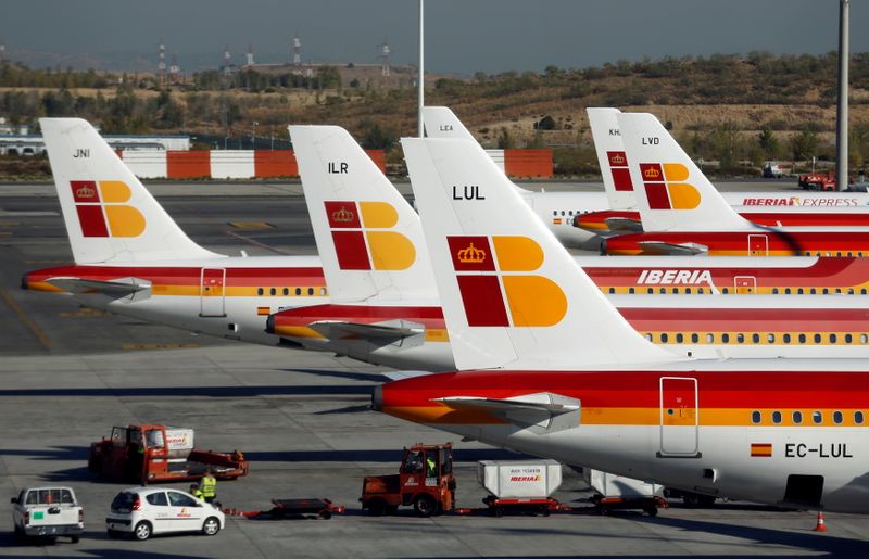 FILE PHOTO: Passenger planes of Spain’s flagship Iberia airline are