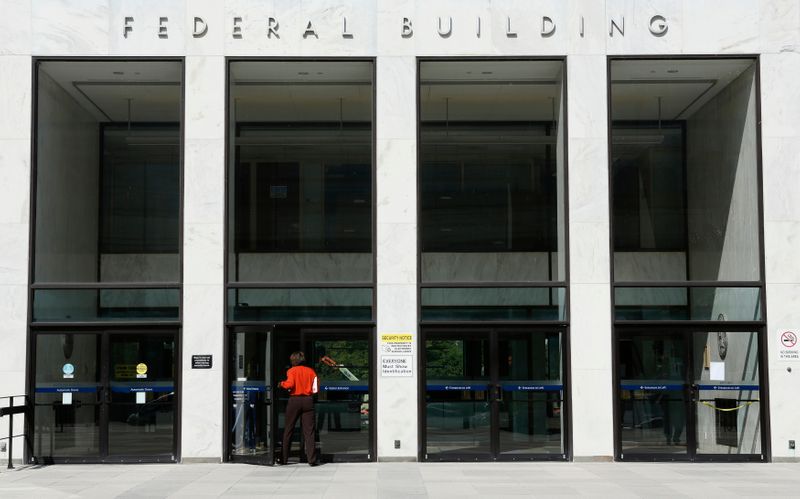 FILE PHOTO: A worker enters a transportation department federal building