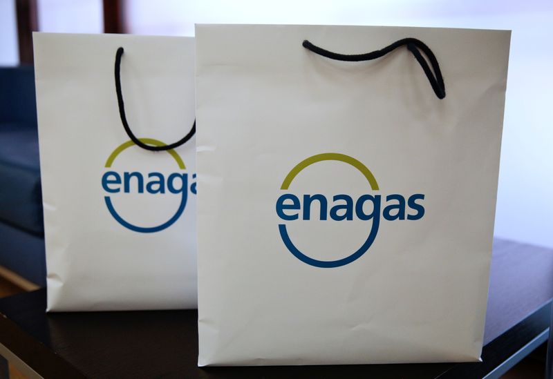 The logo of Enagas can be seen on two bags