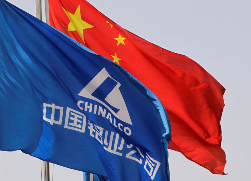 Aluminum Corp of China flag flutters outside its headquarters in