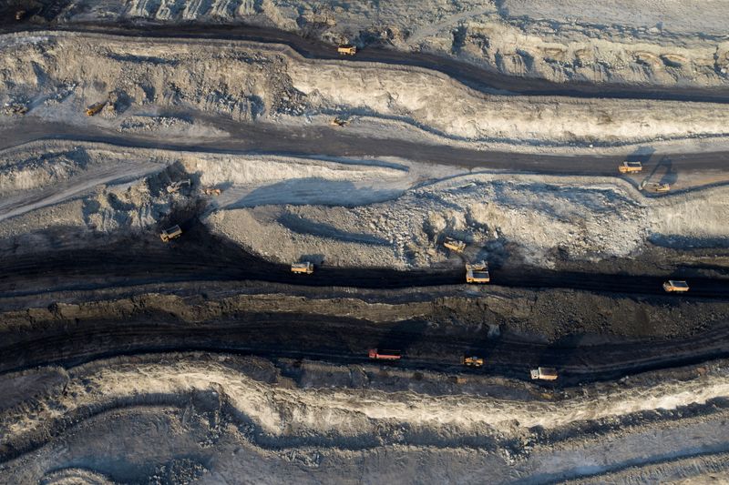 Aerial view shows machinery working in an open-pit coal mine