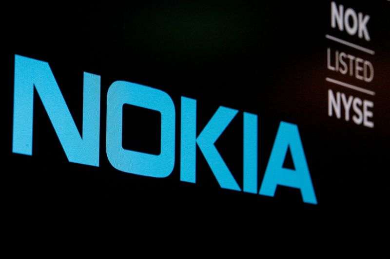 FILE PHOTO: The logo and ticker for Nokia are displayed