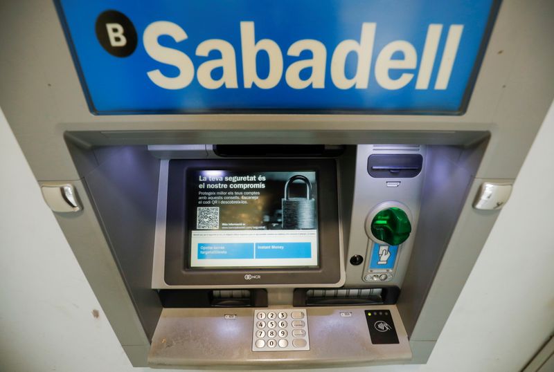 Sabadell bank’s logo is seen at an ATM machine outside