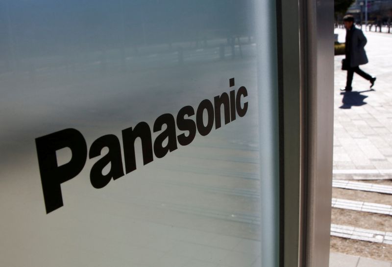 FILE PHOTO: A man is seen next to Panasonic Corp’s