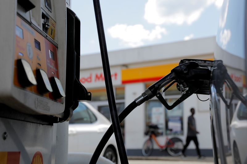FILE PHOTO: A gas pump is seen in a car