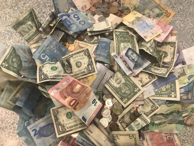 U.S. dollars and other world currencies lie in a charity