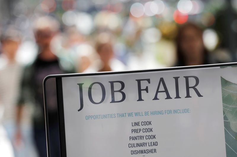 Signage for a job fair is seen on 5th Avenue