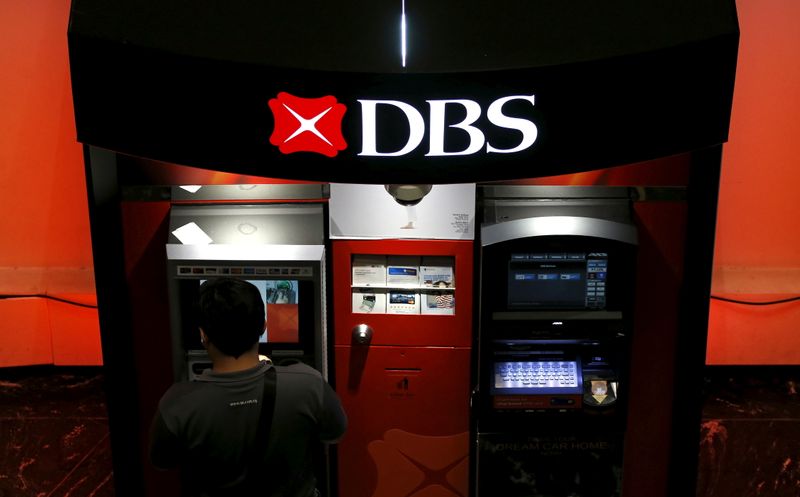 FILE PHOTO: A man uses a DBS automated teller machine