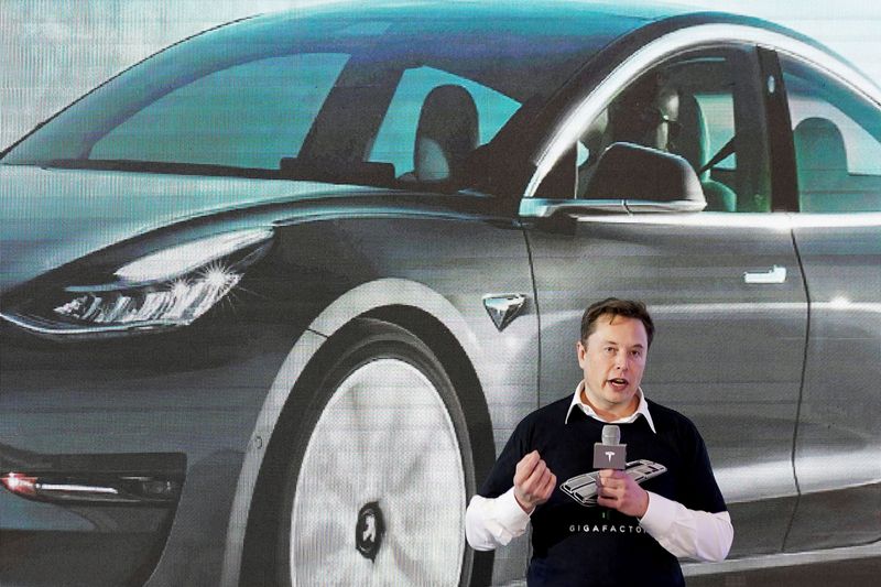 FILE PHOTO: Tesla Inc’s Musk speaks during a delivery event