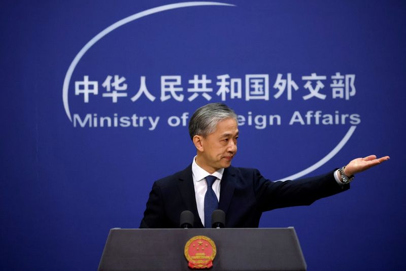FILE PHOTO: Chinese Foreign Ministry spokesman Wang Wenbin attends a