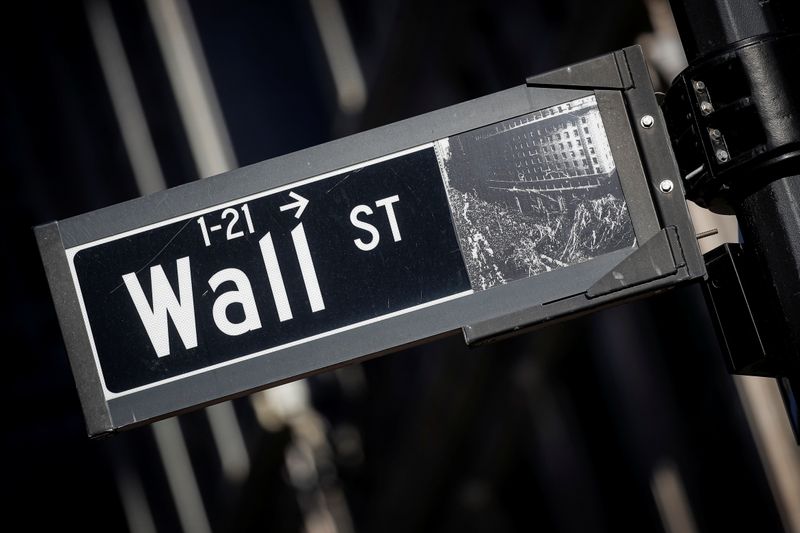 A street sign for Wall Street is seen in the