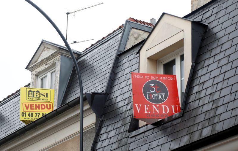 FILE PHOTO: Real estate signs near Paris