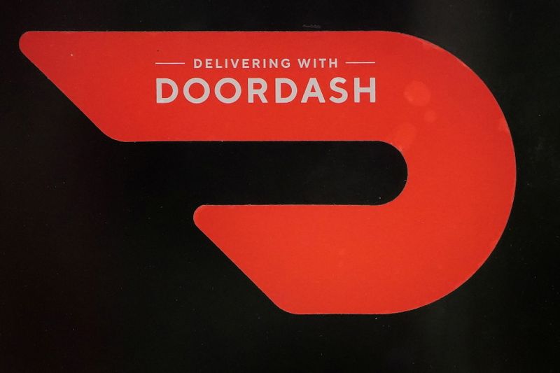 A DoorDash sign is pictured on a restaurant on the
