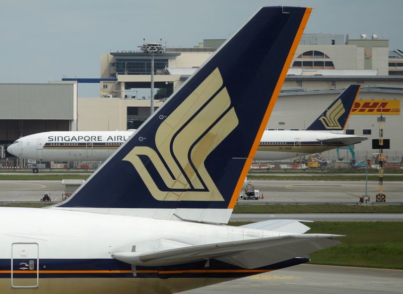 FILE PHOTO: Singapore Airlines planes sit on the tarmac at
