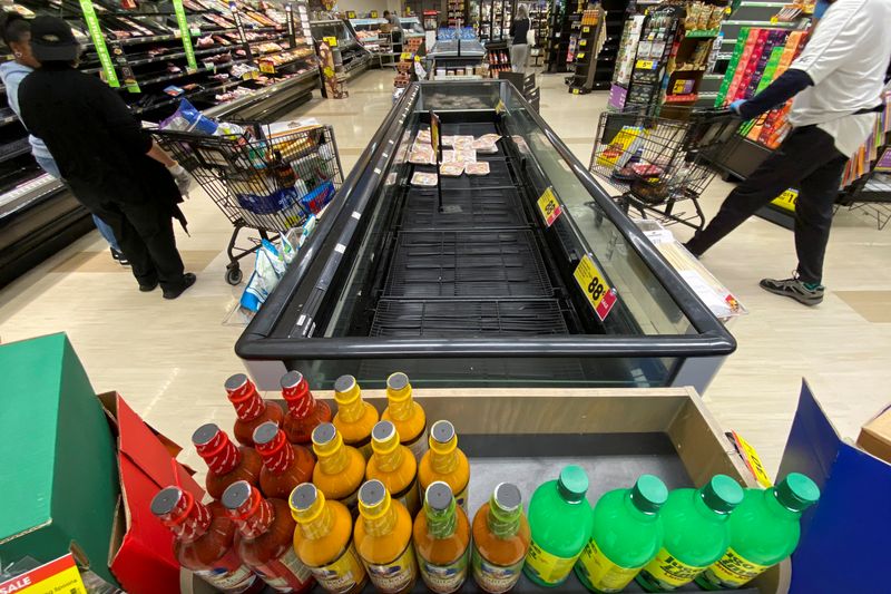 FILE PHOTO: Customers browse grocery store shelves inside Kroger Co.’s