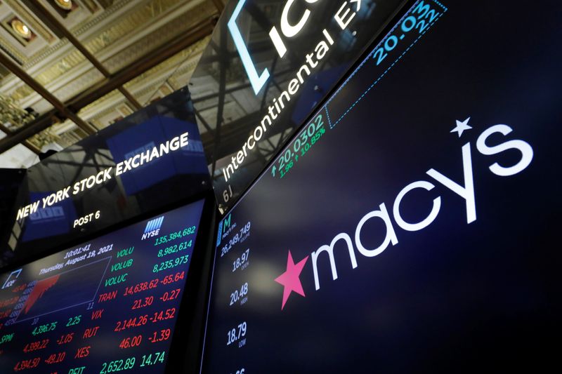 The Macy’s logo is displayed on the trading floor at