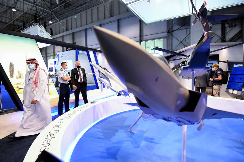 People visit Lockheed Martin Aerospace company display during Dubai Airshow