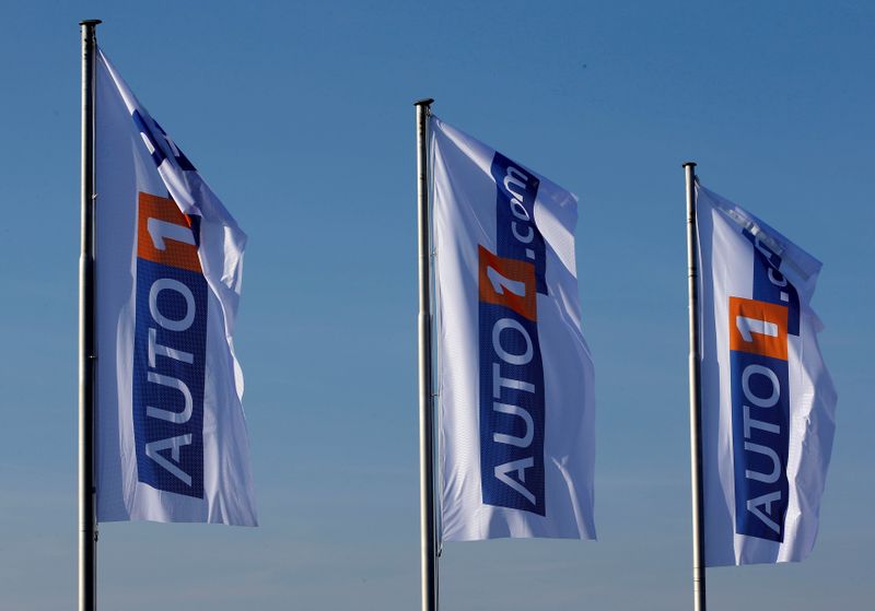 FILE PHOTO: Flags bearing the AUTO1 logo pictured at the