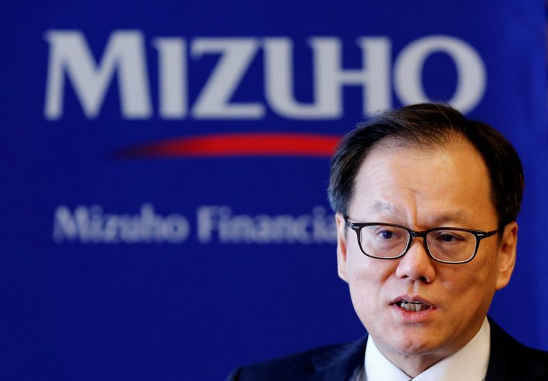 Mizuho Financial Group’s Chief Executive Officer Tatsufumi Sakai attends an
