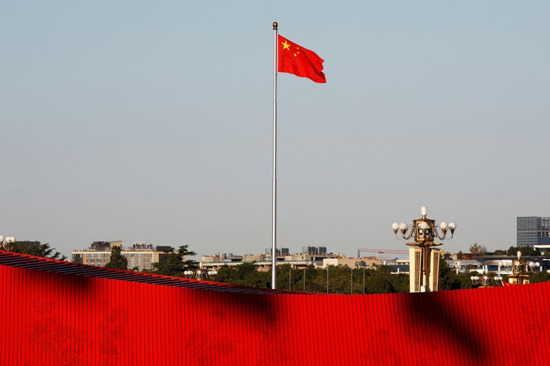 FILE PHOTO: Chinese flag flutters at the Tiananmen Square in